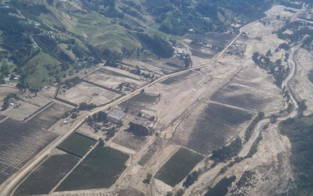 The aftermath of massive flooding that swept through the Esk Valley during Cyclone Gabrielle. The river's normal path can be seen running down the right of the valley.