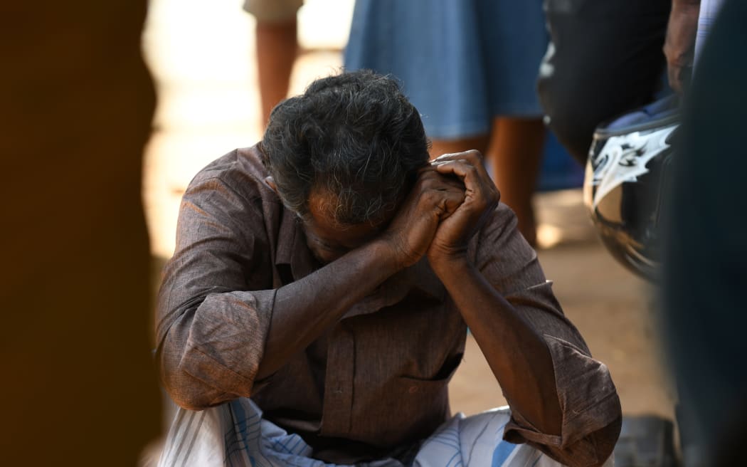 A relative of a Sri Lankan victim of an explosion at a church weeps outside a hospital in Batticaloa in eastern Sri Lanka.
