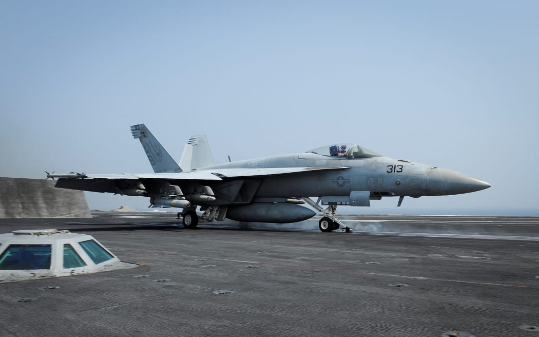 An F/A-18E Super Hornet launches from aircraft carrier USS Theodore Roosevelt on 21 August 2015 in the Gulf, as part of the US-led coalition's operations in Iraq and Syria.