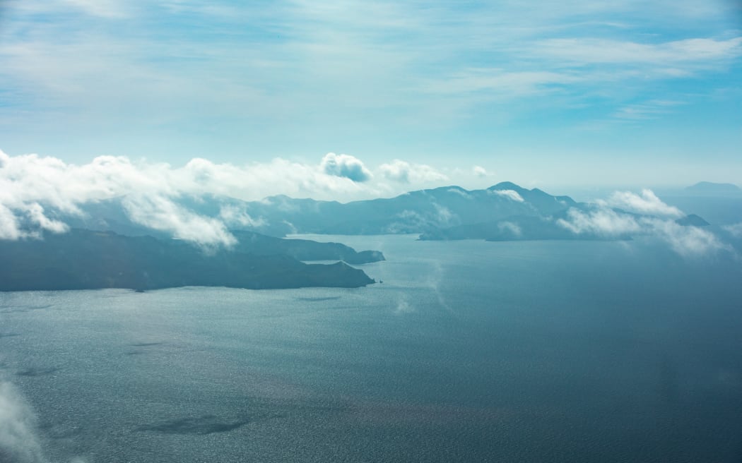 An aerial image of the east coast of Great Barrier Island.