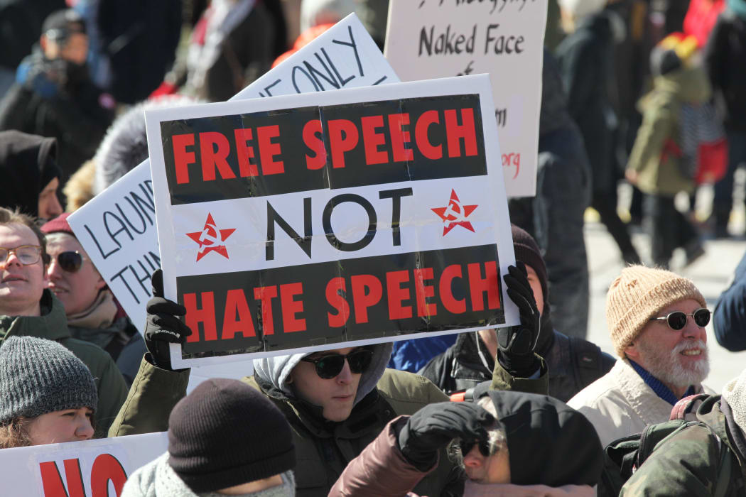 A pro-Muslim protestor carrying a sign saying 'Free Speech NOT Hate Speech' as opposing groups of protesters clashed over the M-103 motion to fight Islamophobia during pro-Muslim and anti-Muslim demonstrations in downtown Toronto; Ontario; Canada; on March 04; 2017.