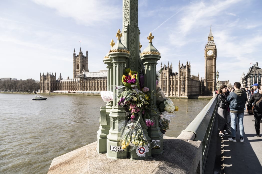 Flowers are laid on Westminster bridge in London on March 25, 2017 in tribute to the victims of the London Parliament attack that took place on March 22.