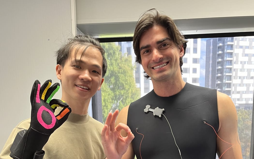 Cheng-Huan Lu and Dr Derek Orbaugh with their smart diving glove and wetsuit vest.