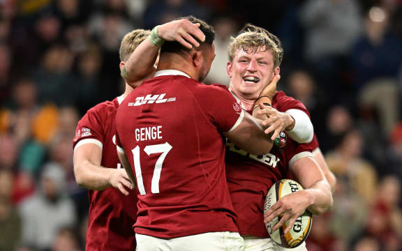 Jac Morgan of the Lions celebrates scoring a try.