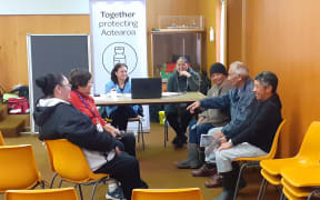 Whānau relax after getting their Covid-19 jabs at the whole-of-community Rātana vaccination clinic on Friday 6 August.