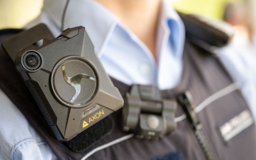 A German police officer is wearing an Axon body camera.