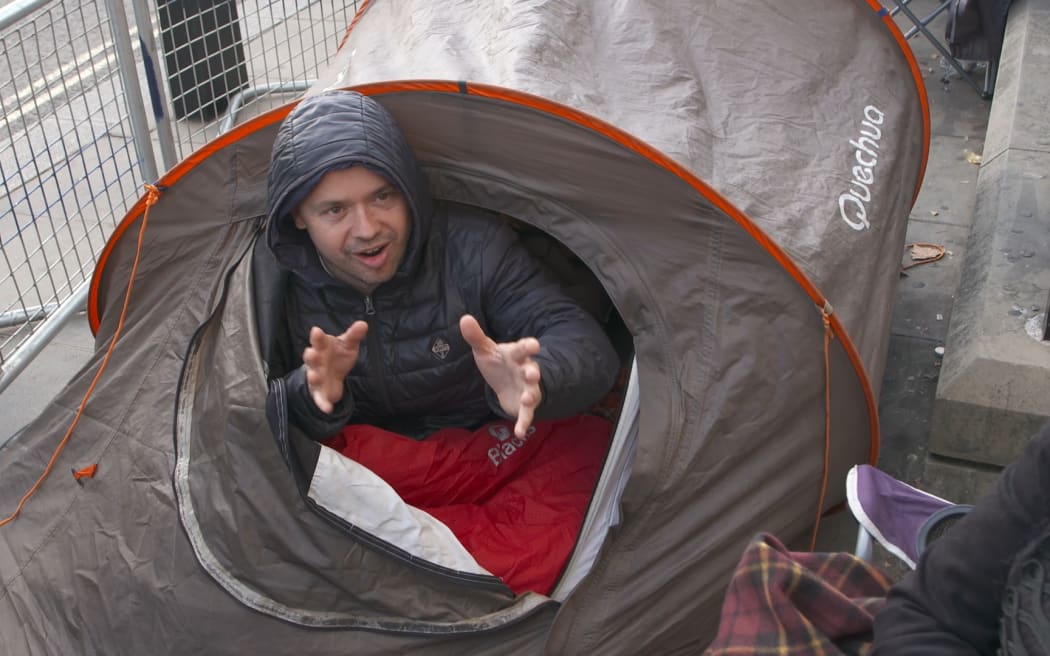 A mourner named Steve waits in his tent across from Westminster Abbey.