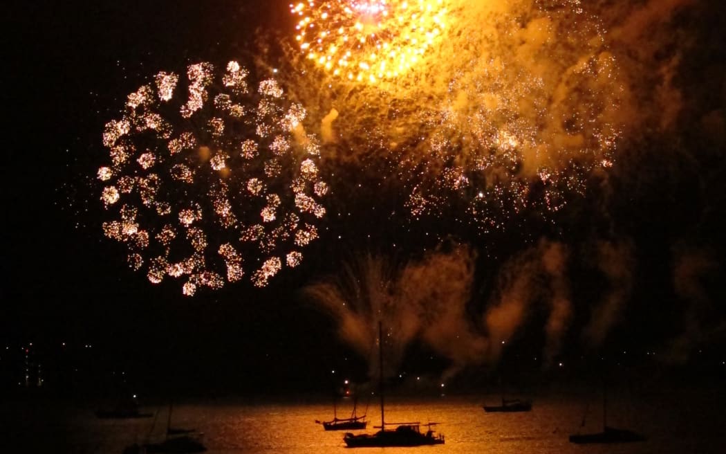 Fireworks are launched from a barge moored between Paihia and Russell, in the Bay of Islands, to make the start of a new year.