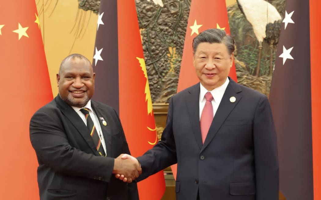 PM James Marape, left, and Chinese President Xi Jinping.