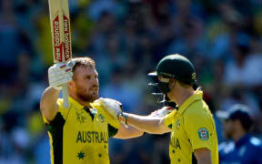 Australia's Aaron Finch celebrates a century.