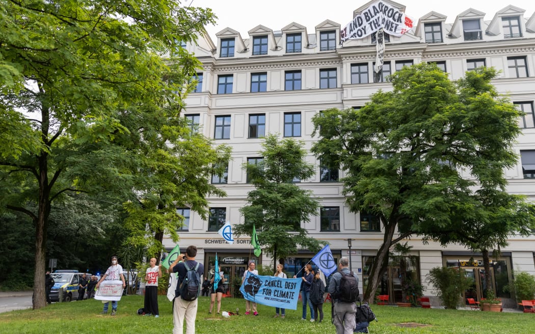 Climate activists in Munich demonstrating against US wealth manager BlackRock and calling for debt relief for poorer countries during the G7 summit, on 28 June 2022.