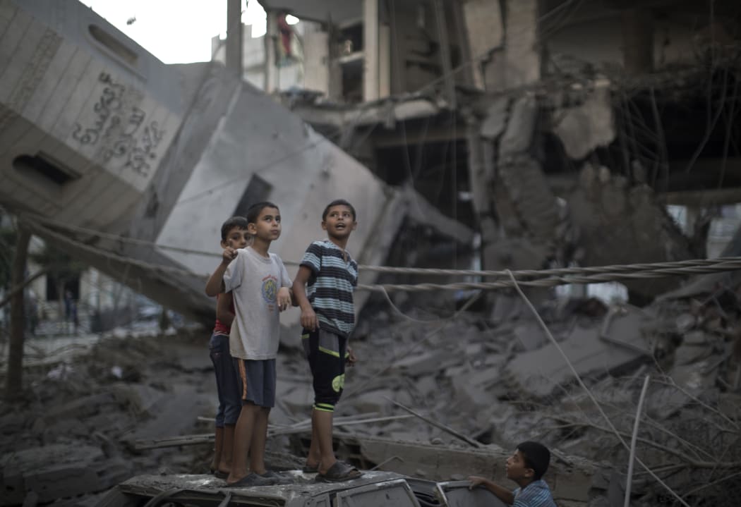 Palestinian children at what's left of a mosque in Gaza City.