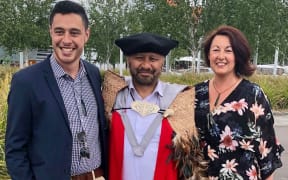 Te Hurinui Karaka-Clarke and his whānau
on graduation day (From left - youngest son Richie Renata Clarke, Te Hurinui Karaka-Clarke and wife Claire Robertshaw).
