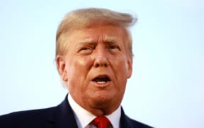 (File photo). Former US President Donald Trump speaks to the media at Atlanta Hartsfield-Jackson International Airport after being booked at the Fulton County jail on 24 August, 2023 in Atlanta, Georgia. T