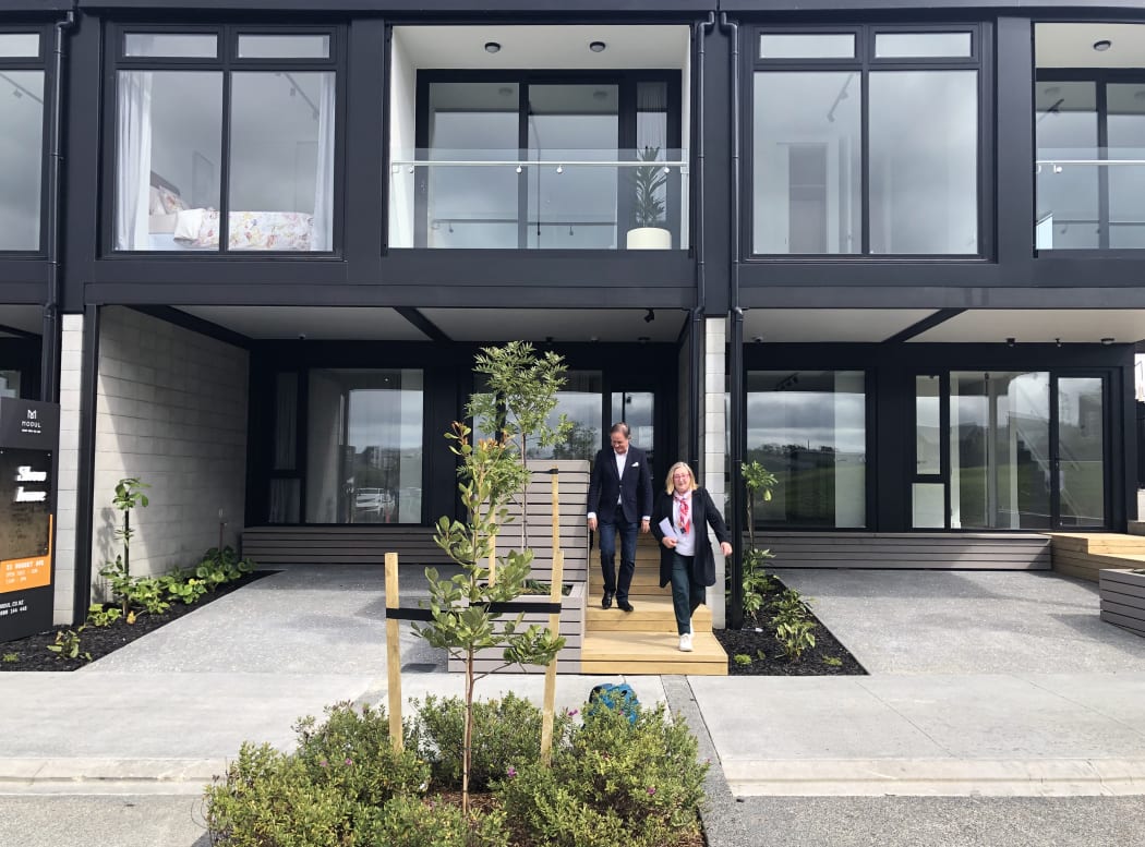 Anne Gibson and Tony Houston outside the new Hobsonville pre-fab housing