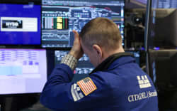 A trader works on the floor of the New York Stock Exchange in New York City, on April 7, 2025. Wall Street stocks opened sharply lower Monday, joining a global selloff on worries that a trade war induced by US President Donald Trump’s tariffs will spark a global economic slowdown. (Photo by TIMOTHY A. CLARY / AFP)