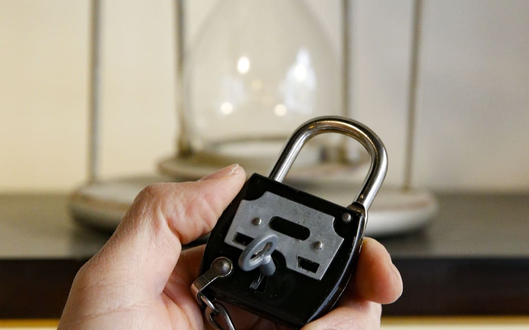 A picture shows the time left to leave the room during an "escape game" session in Paris, on May 24, 2018. Participants of these games are expected to look for clues and then combine them in order to solve enigmas in a limited time.