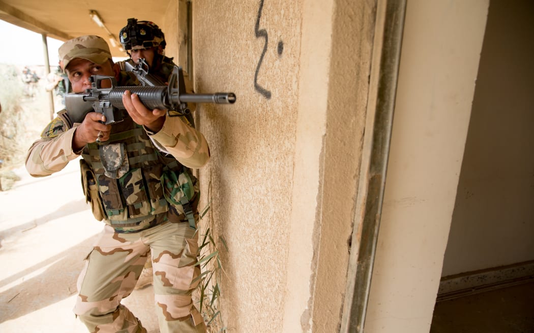 Iraqi troops training in urban clearances and tactics.