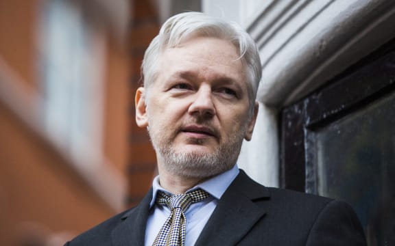 WikiLeaks founder Julian Assange addresses the media from the balcony of the Ecuadorian embassy in central London on February 5, 2016.