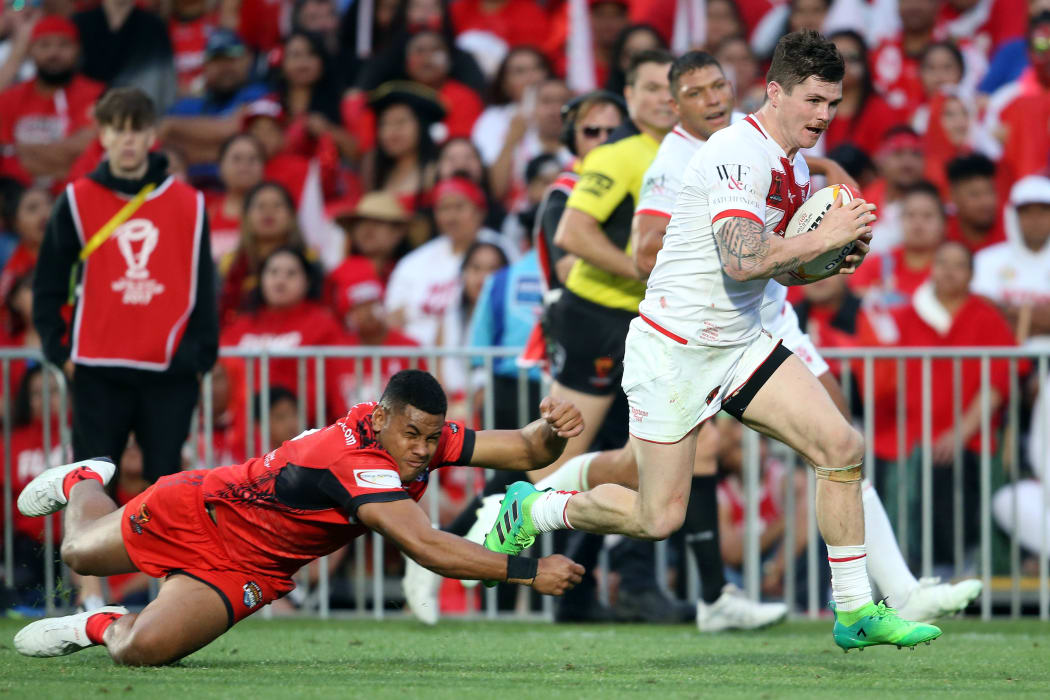 England's John Bateman runs for a try during the Rugby League World Cup semi-final against Tonga.