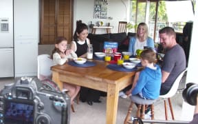 Actress Alyssa Chia eating breakfast with Kiwi family being filmed by Chinese production crew for Chinese social media campaign.