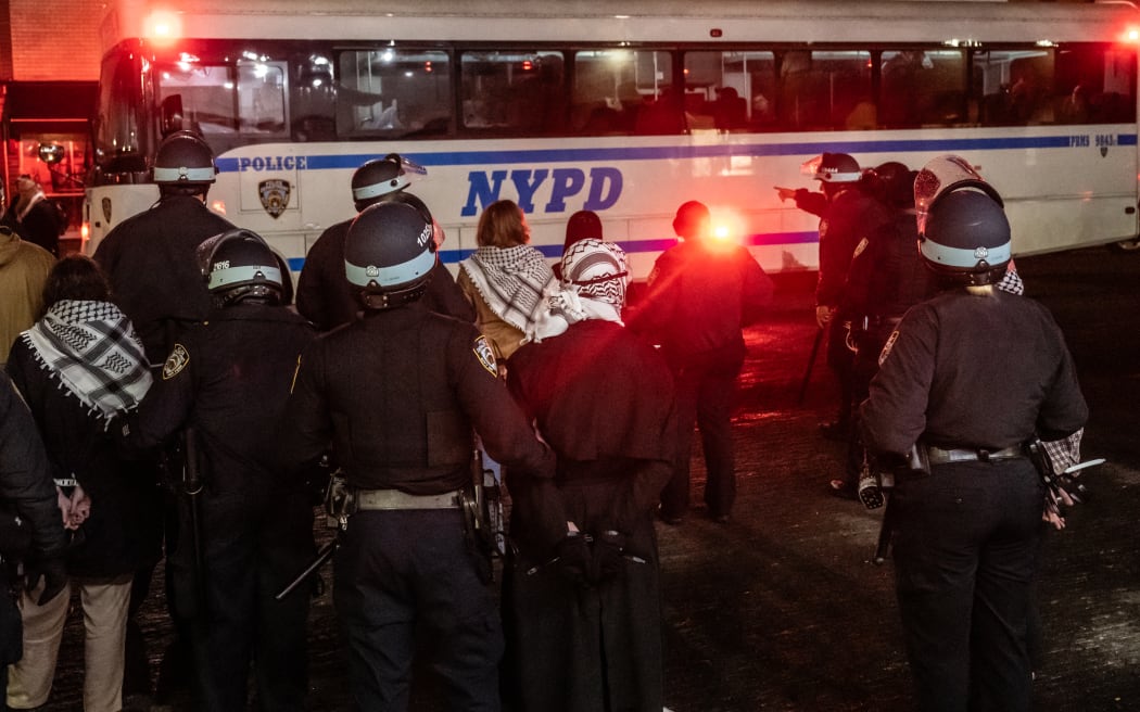 Members of the NYPD detain protesters from the pro-Palestinian protest encampment and Hamilton Hall where demonstrators barricaded themselves inside on April 30, 2024 in New York City.