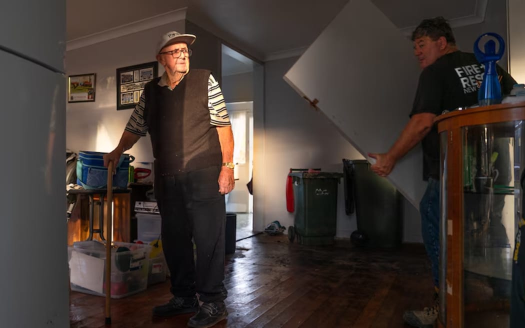 Michael Wicks watched on as his family had to tear apart his flood-damaged home.