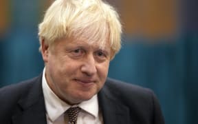 Britain's Prime Minister Boris Johnson speaks to the media as he visits a Covid-19 vaccination centre at Little Venice Sports Centre in London on October 22, 2021.