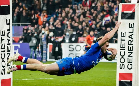 France's Damian Penaud scores a try.