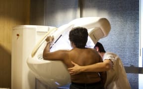 RADIOLOGY CENTER 
Reportage in a radiology centre in Haute-Savoie, France. A technicien carries out a routine mammogram. 

AMELIE-BENOIST / BSIP (Photo by AMELIE-BENOIST / BSIP / BSIP via AFP)