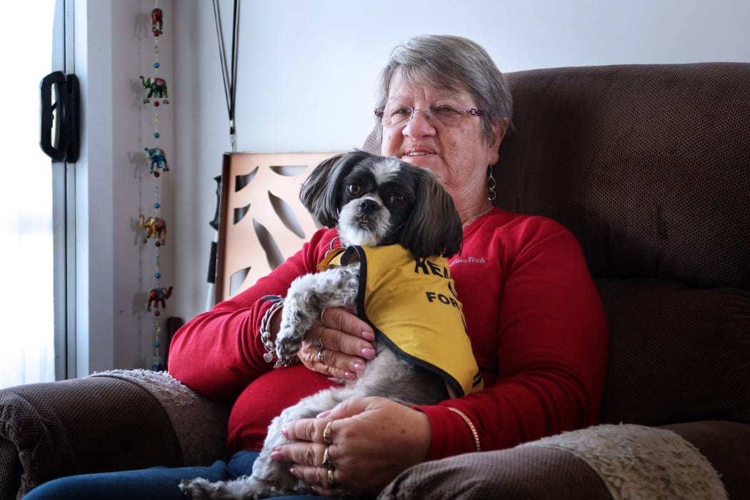 "It would mean cost-cutting everywhere," says Lynn Evans, pictured with her hearing dog Gem.