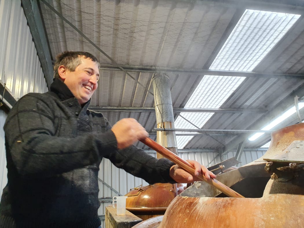 James Cooper "mashing in" at his on-farm brewery near Taupo