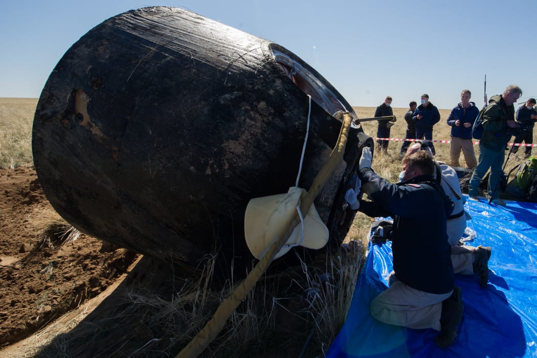 A search and rescue team at the landing site of the Soyuz MS-15 capsule, in a remote area of Kazakhstan.