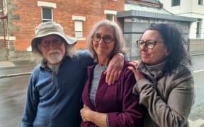 Dunedin climate activist Rosemary Penwarden (middle) after being sentenced to 125 hours of community services at the Dunedin District Court.
