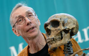 Swedish evolutionary researcher Svante Pääbo, who has been awarded the Nobel Prize in Medicine or Physiology, stands next to a replica of a Neanderthal skeleton at the Max Planck Institute for Evolutionary Anthropology in Leipzig, 3 October 2022.