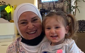 Hala's mother Mayada Kerdmsesto with granddaughter Tia when they met in Malaysia.
