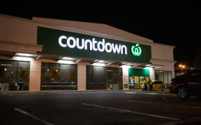 Police standing guard outside the Cumberland Street Countdown in Dunedin on Tuesday night after four people were stabbed there in an attack that afternoon.
