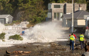 A bridge near Ōwhiro Bay is damaged after massive swells overtook the area.