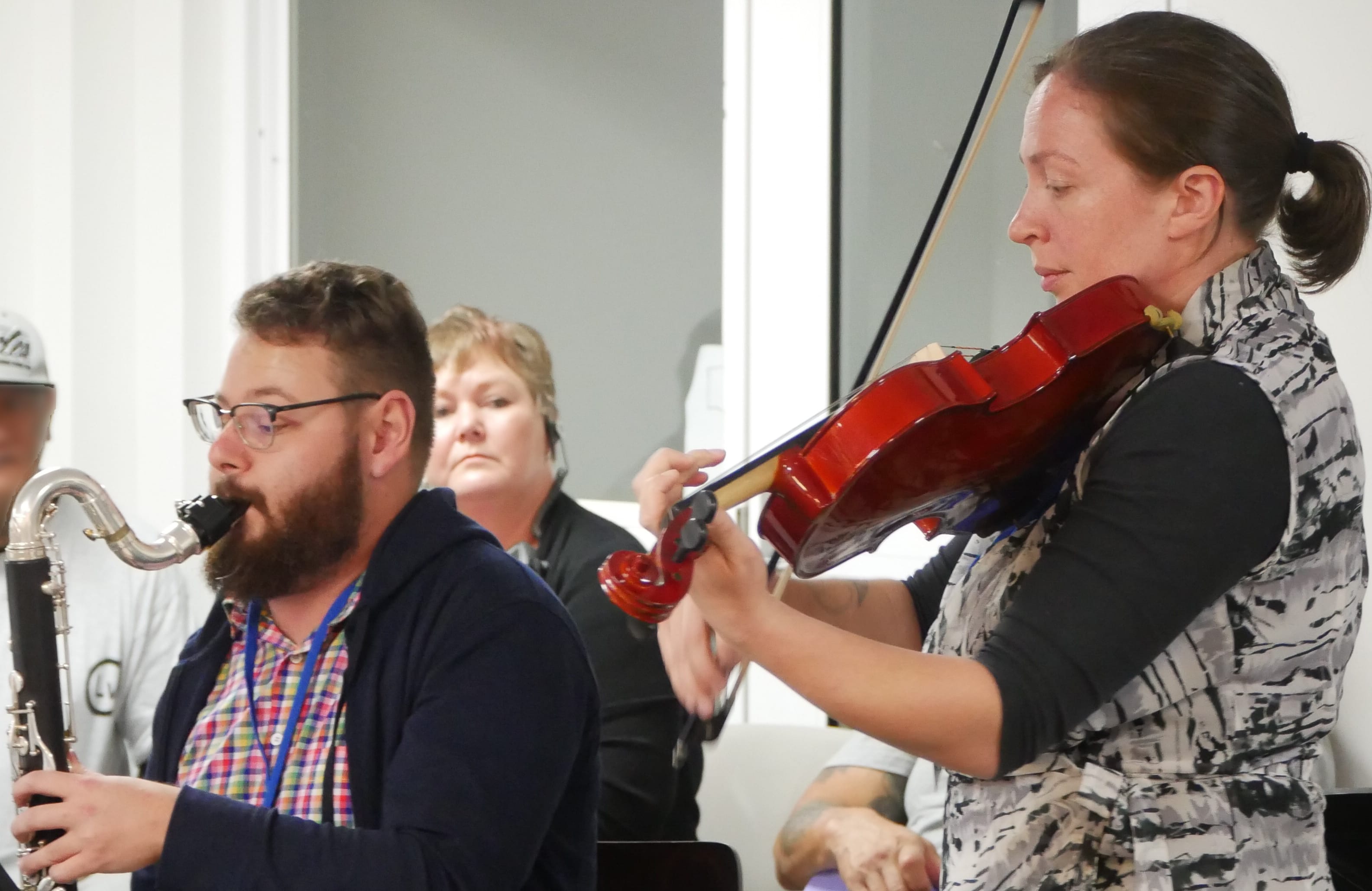 Members of the Christchurch Symphony Orchestra perform with prisoners