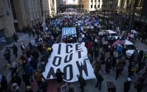 Protestors march during a "Nationwide Shutdown" demonstration against ICE enforcement on January 30, 2026 in Minneapolis, Minnesota.