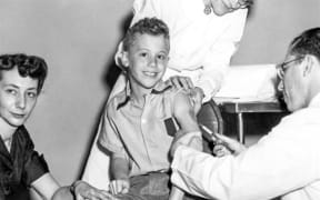 Peter Salk getting Polio vaccine from his Father Dr Jonas Salk