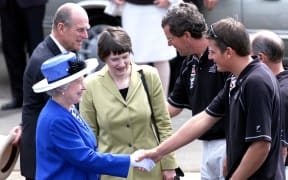 Queen Elizabeth, pictured with then-prime minister Helen Clark, meets with the Team New Zealand skipper at the time, Dean Barker, during her last visit to New Zealand