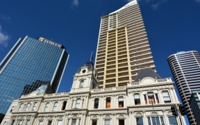 Auckland old Customhouse under modern building. Since the 19th century European settlement Auckland become the fastest-growing and commercially dominating city of New Zealand