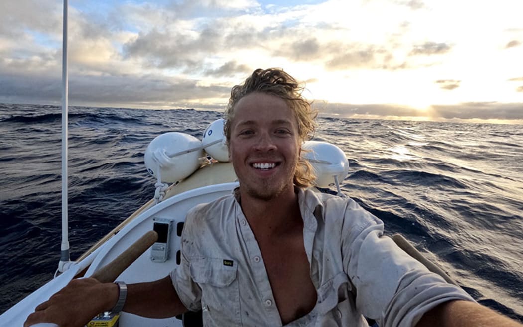 Twenty-three-year-old Brisbane man Tom Robinson at the oars somewhere between Peru and Penrhyn Atoll/Tongareva on his solo voyage across the Pacific