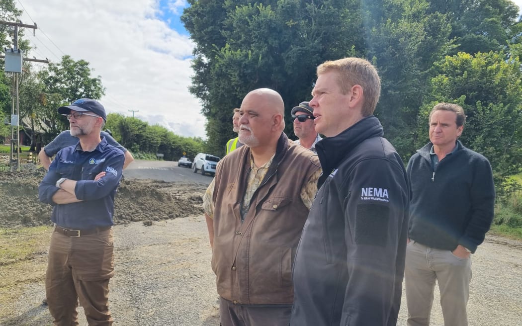 Prime Minister Chris Hipkins (front right) talks to Ratahi Cross of Ngāi Tukairangi Trust at his decimated kiwifruit orchard in Waiohiki.