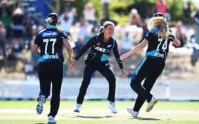 New Zealand players Hannah Rowe and captain Sophie Devine run in to celebrate with Suzi Bates after she took the winning wicket during the 3rd T20 International New Zealand White Ferns v England. Saxton Oval, Nelson, New Zealand. Sunday 24 March 2024. ©Copyright Photo: Chris Symes / www.photosport.nz