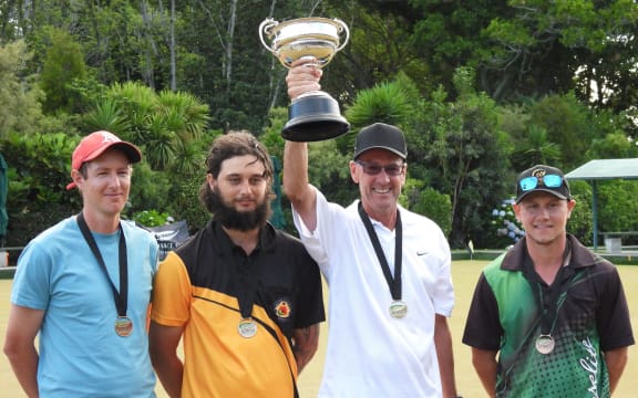 Mike Galloway lifts the national men's singles trophy.