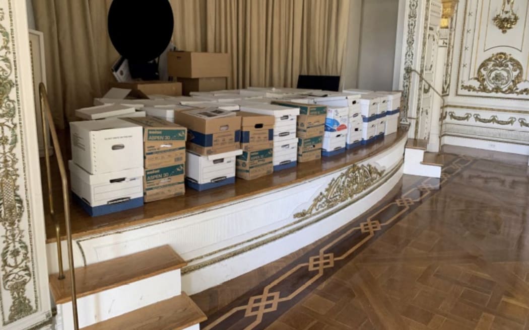 This undated image, released by the US District Court Southern District of Florida, attached as evidence in the indictment against former US president Donald Trump shows stacks of boxes allegedly stored on the stage in the White and Gold Ballroom at Mar-a-Lago, the former presidents private club. Federal prosecutors unsealed a wide-ranging indictment of Donald Trump on Friday, accusing the former US president of endangering national security by holding on to top secret nuclear and defense documents after leaving the White House. (Photo by Handout / US DEPARTMENT OF JUSTICE / AFP) / RESTRICTED TO EDITORIAL USE - MANDATORY CREDIT "AFP PHOTO / US DISTRICT COURT SOUTHERN DISTRICT OF FLORIDA" - NO MARKETING NO ADVERTISING CAMPAIGNS - DISTRIBUTED AS A SERVICE TO CLIENTS