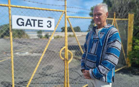 Maurice Bevin at the gates of the now demolished plant.