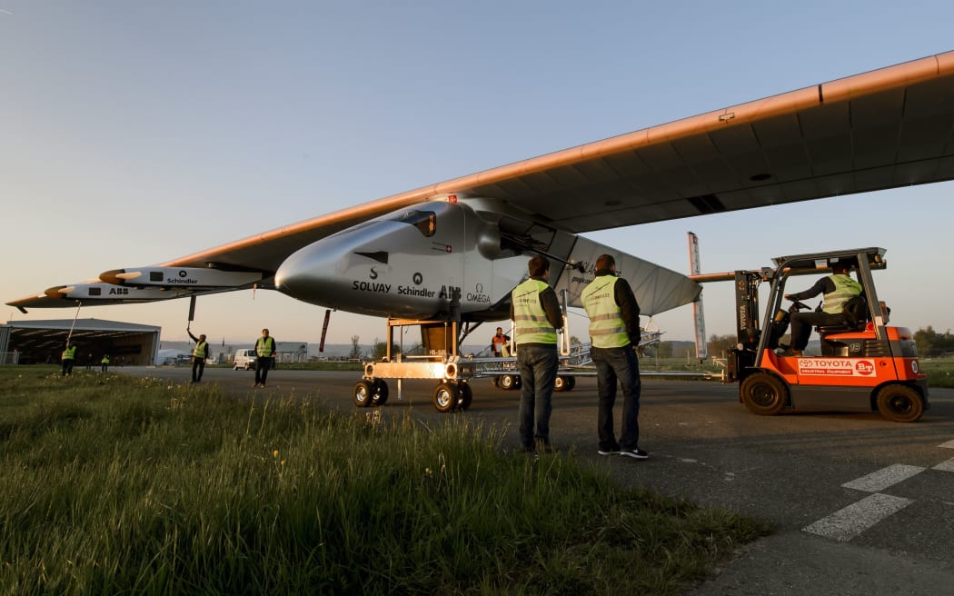The carbon-fibre aircraft has a wingspan wider than a Boeing jet, but weighs only 2.3 tonnes.